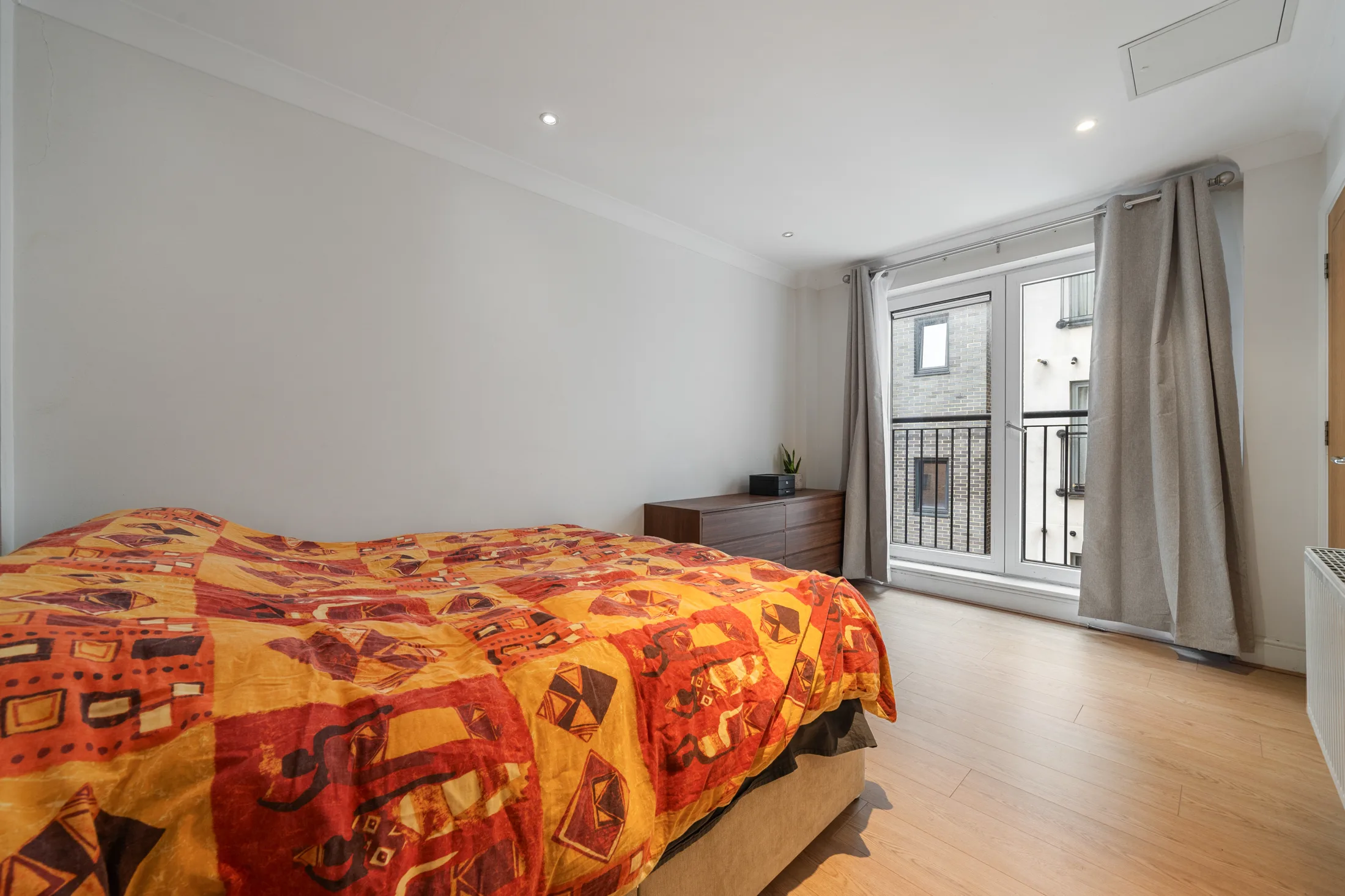 Bedroom with a double bed and large window
