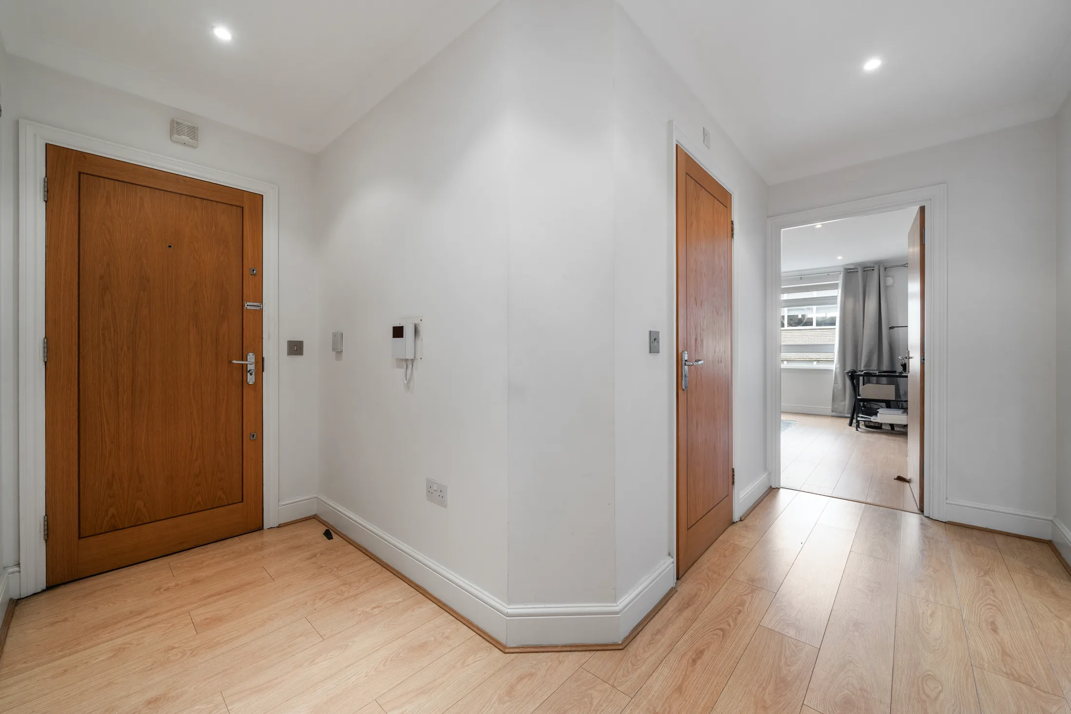 Hallway with timber flooring and internal doors