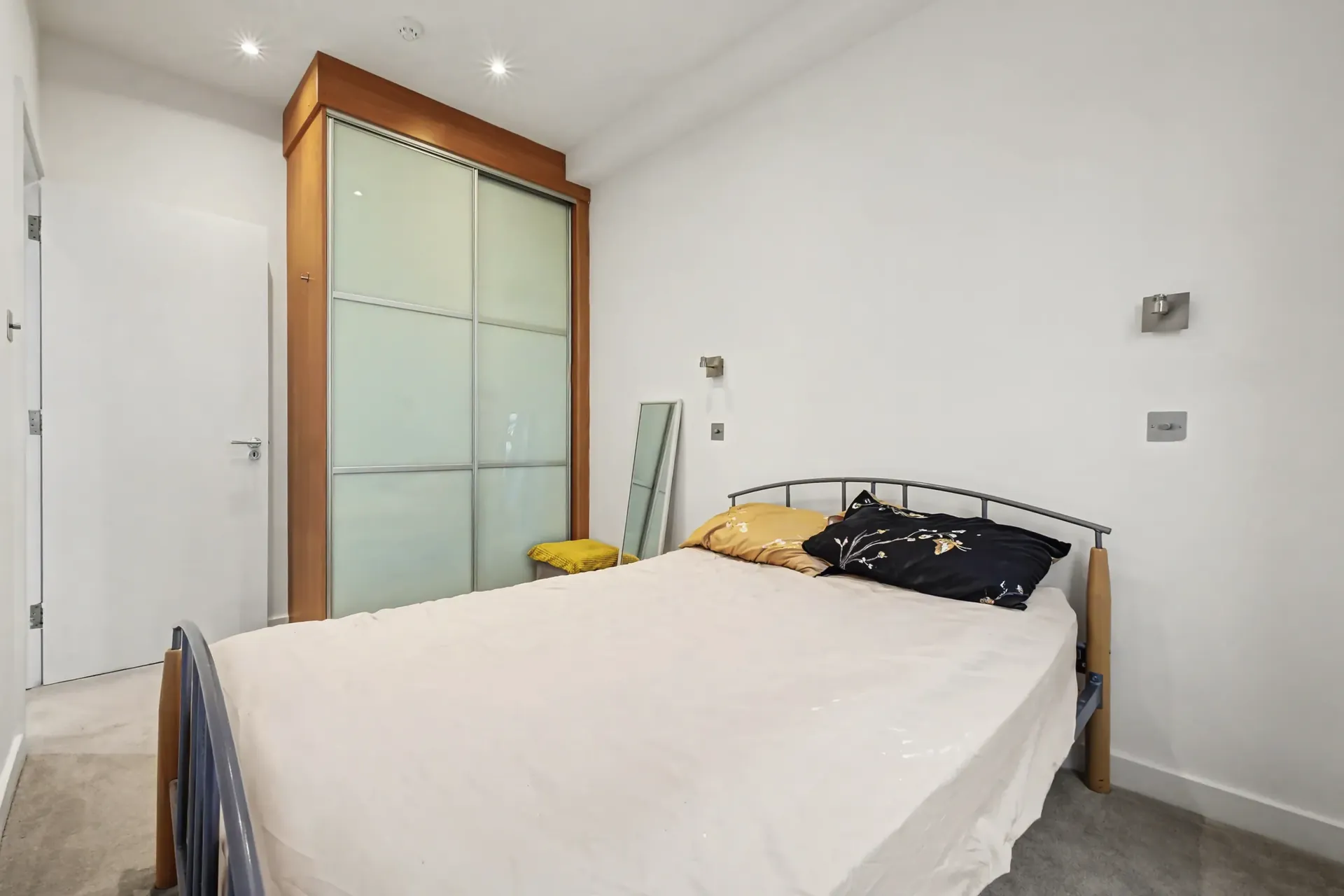 Double bedroom with a fitted wardrobe and carpet