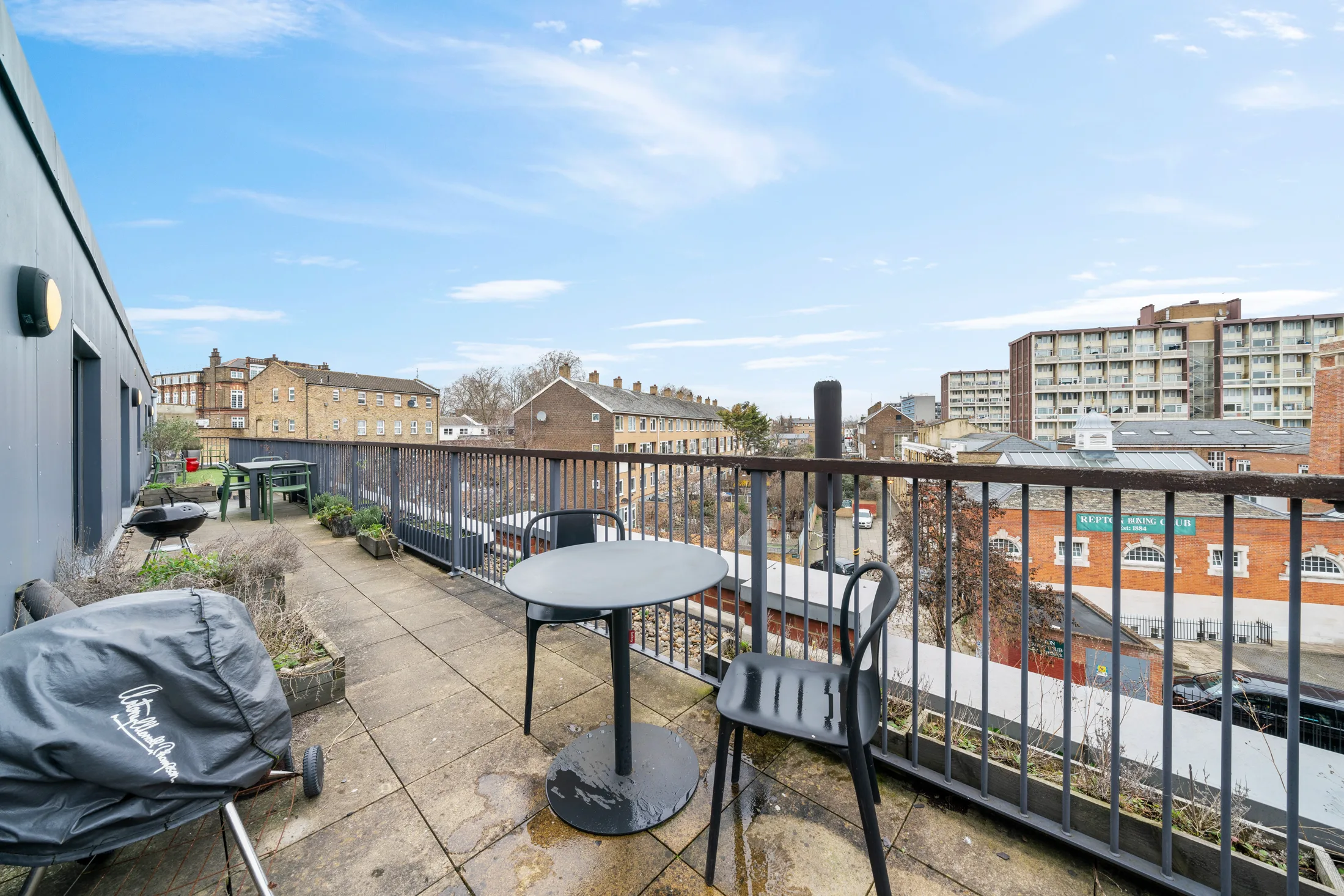 Private terrace with outdoor table, seating and city views