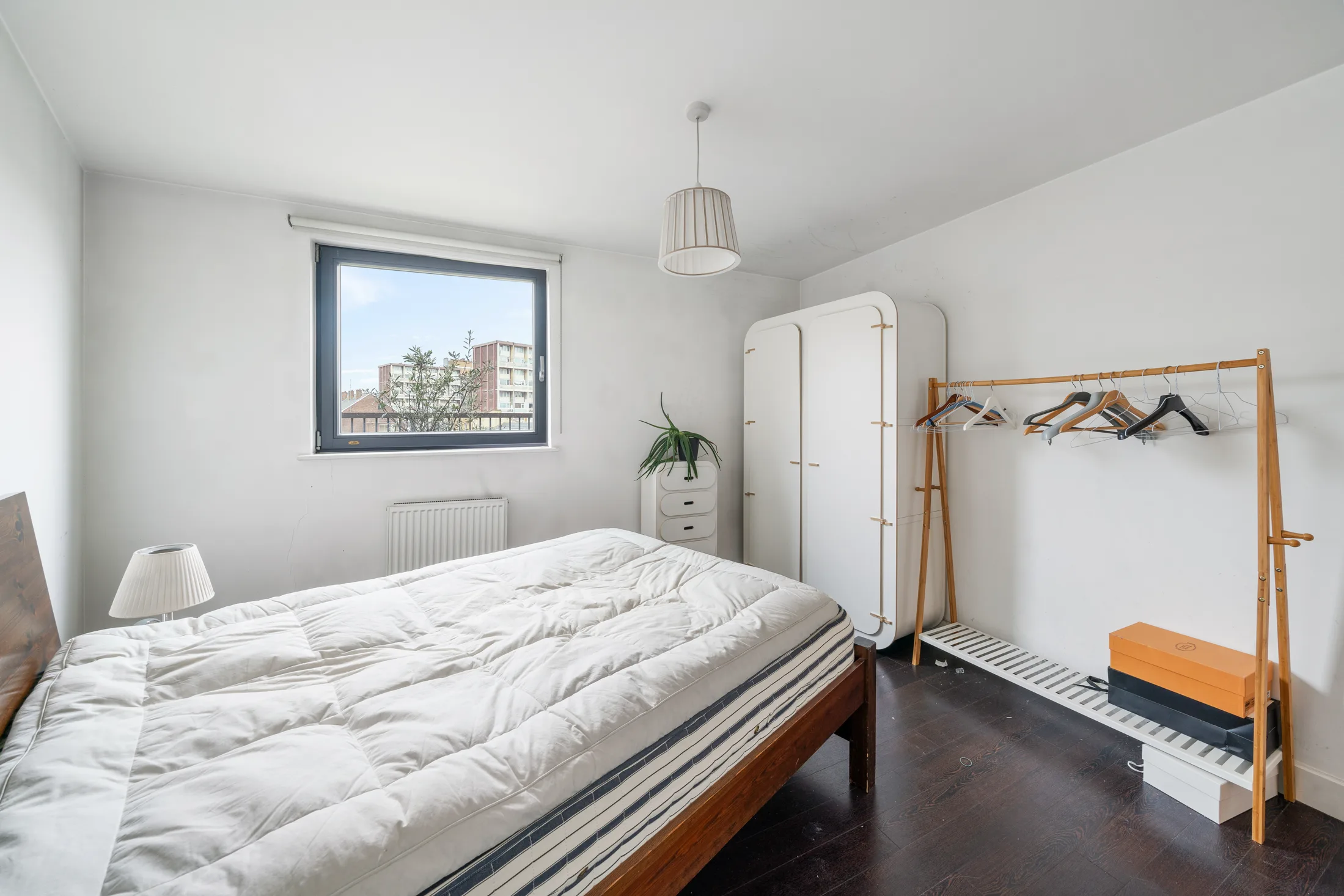 Bedroom with a double bed, wardrobe and clothes rail