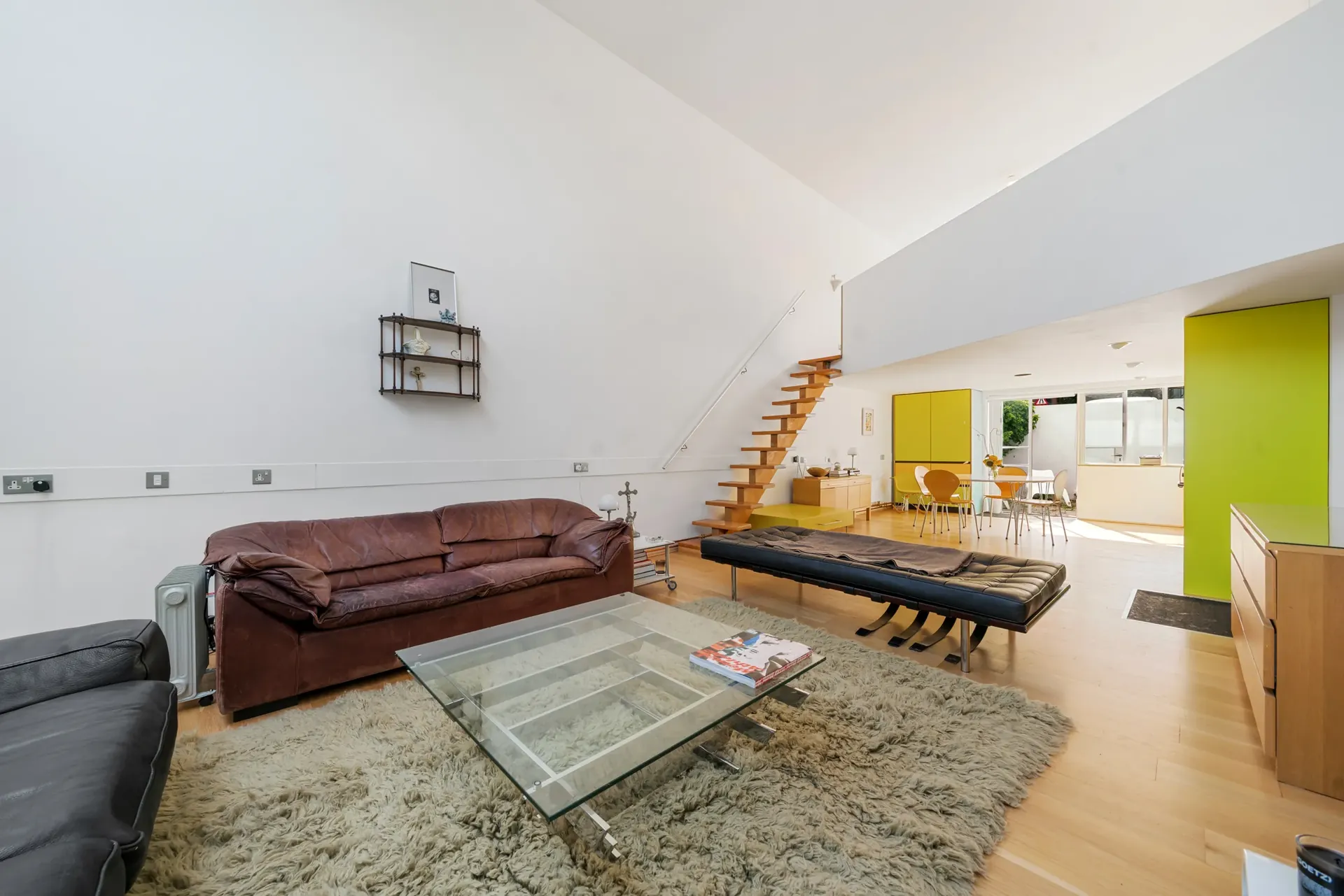 Living room opening onto the kitchen and dining area