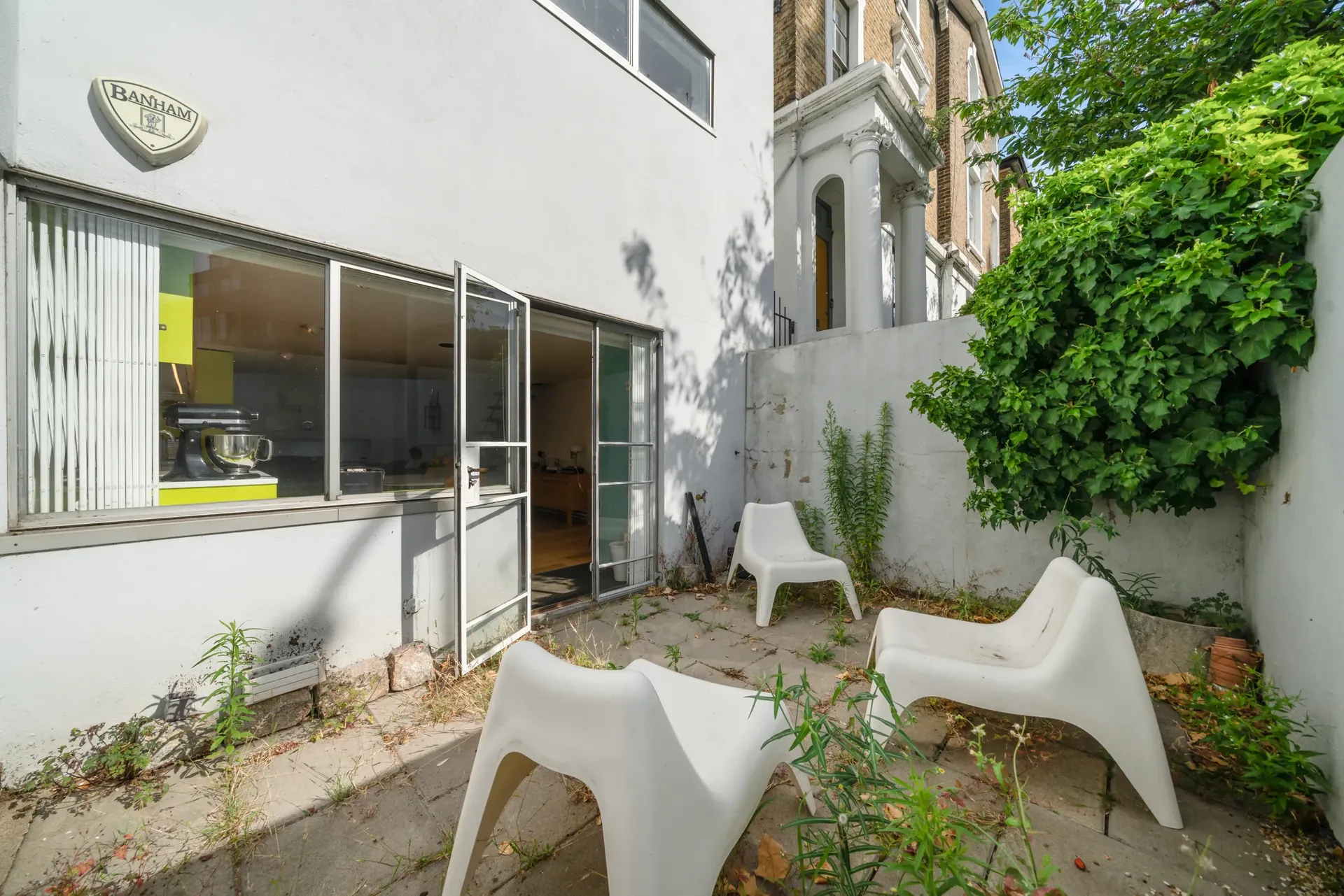 Private patio reached through glazed doors from the kitchen