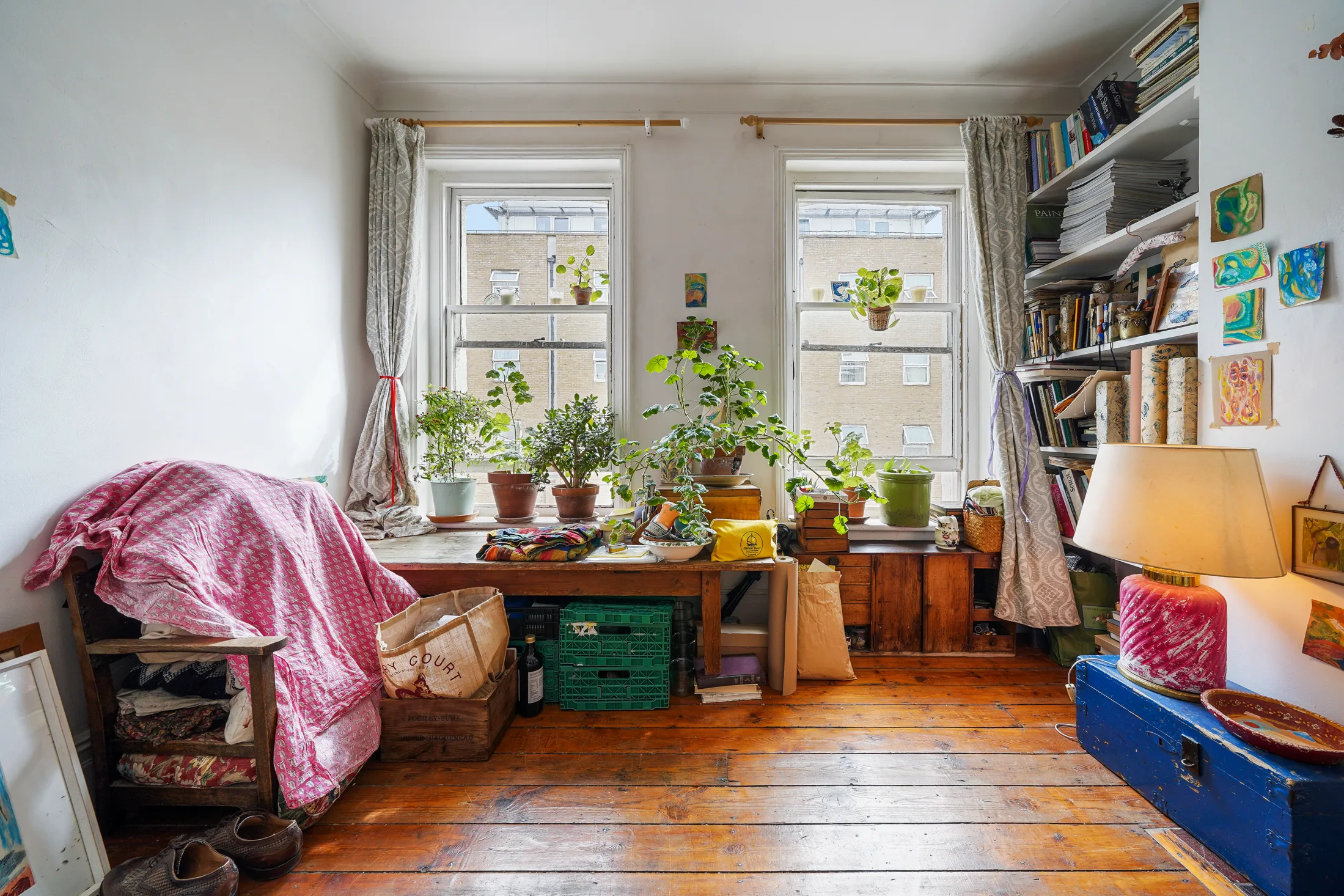 Reception room with seating, bookshelves and a large window