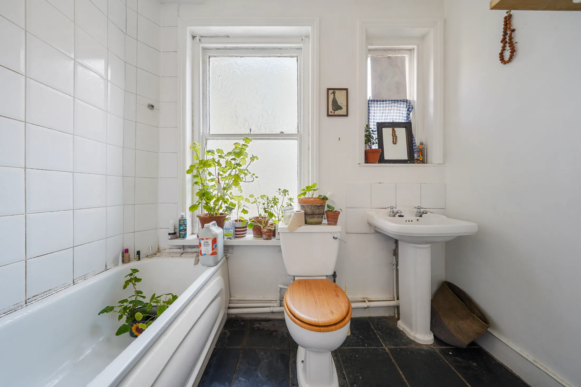 Bathroom with a bath, shower and white sanitaryware