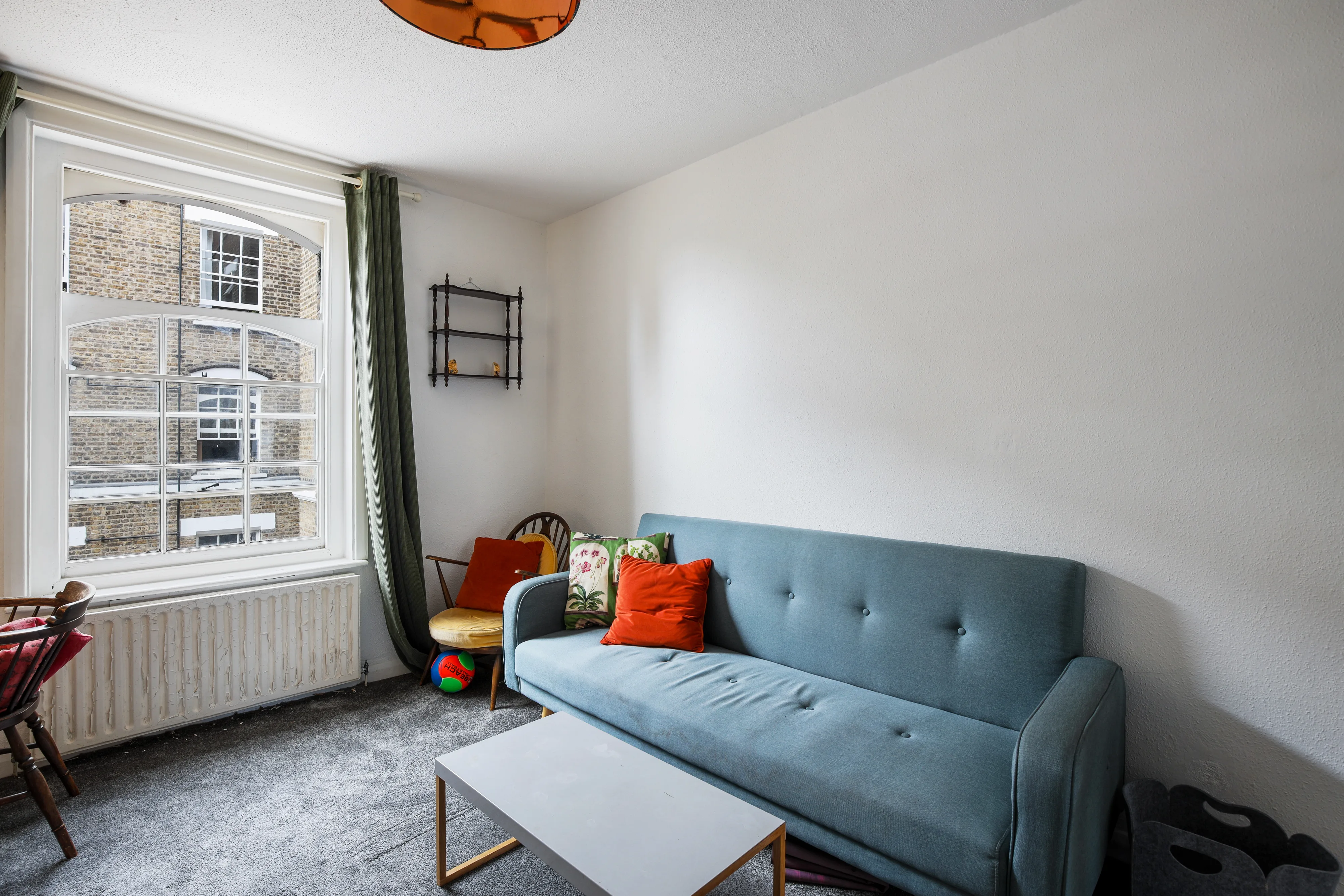 Bedroom with a double bed, wardrobe and large window