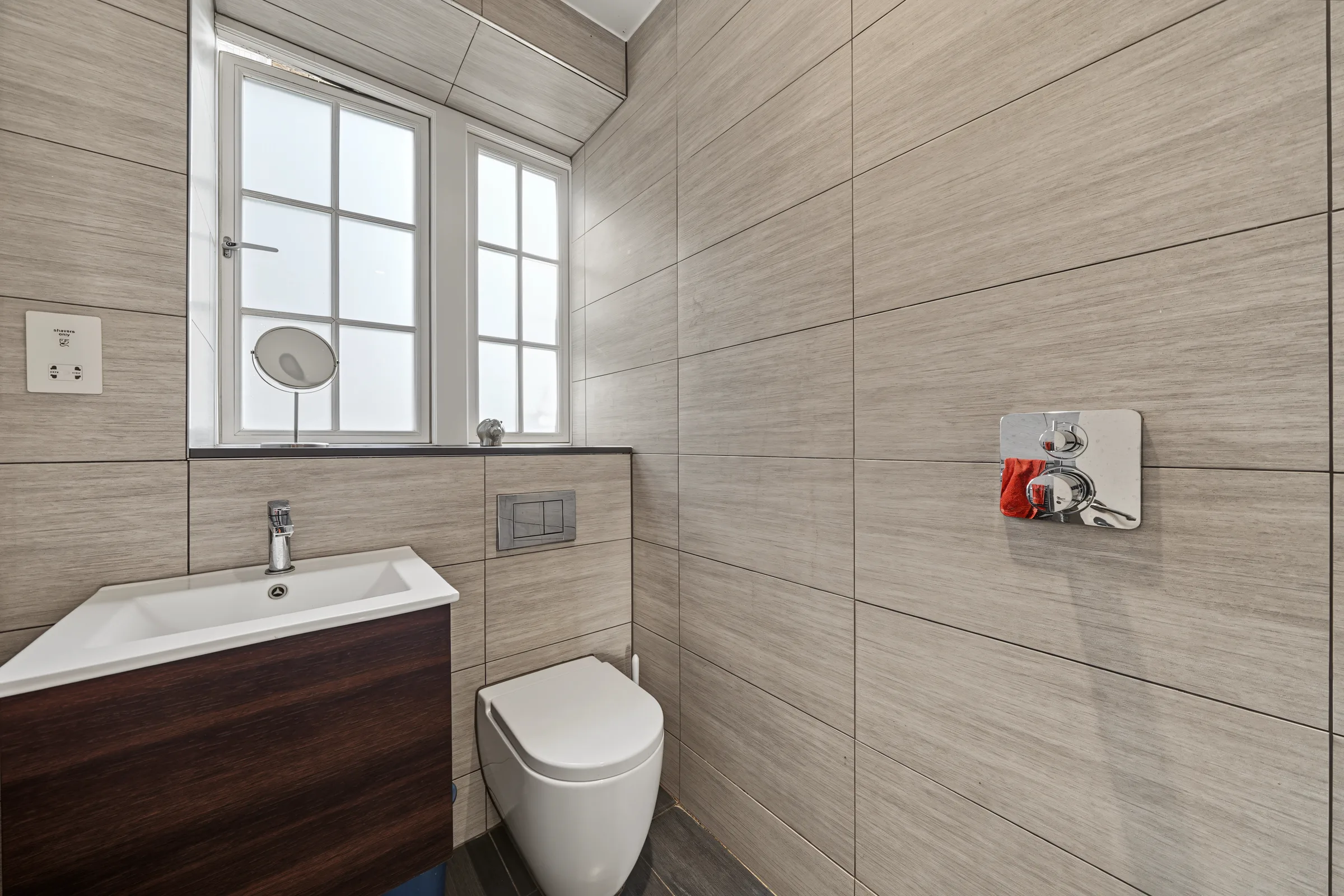 Tiled shower room with a glass enclosure