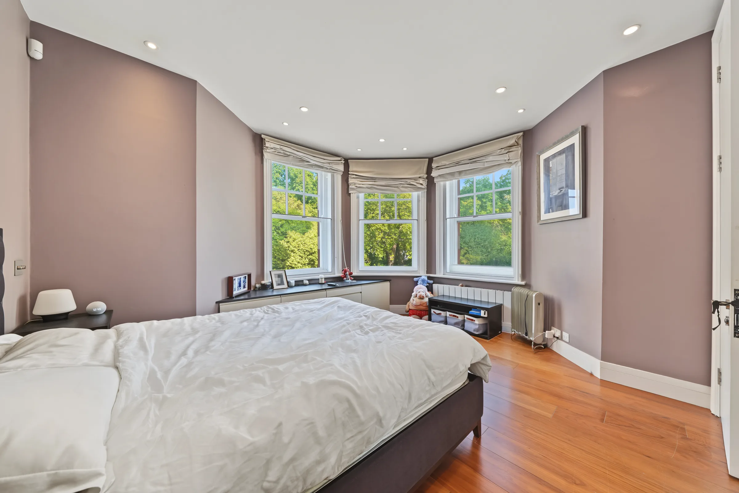 Main bedroom with a large bay window