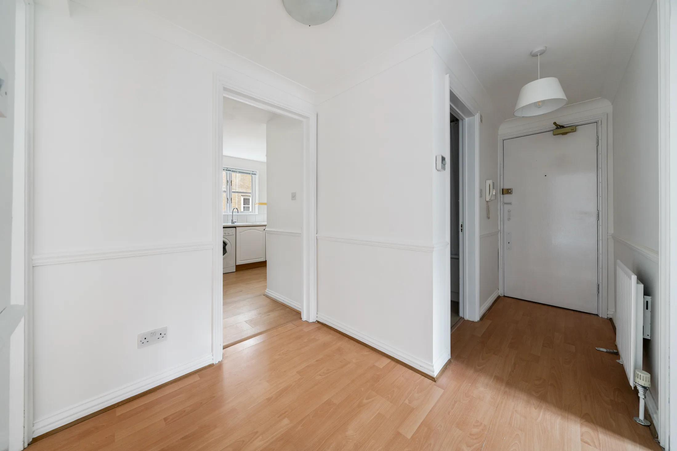 Hallway with timber flooring and doors to the rooms