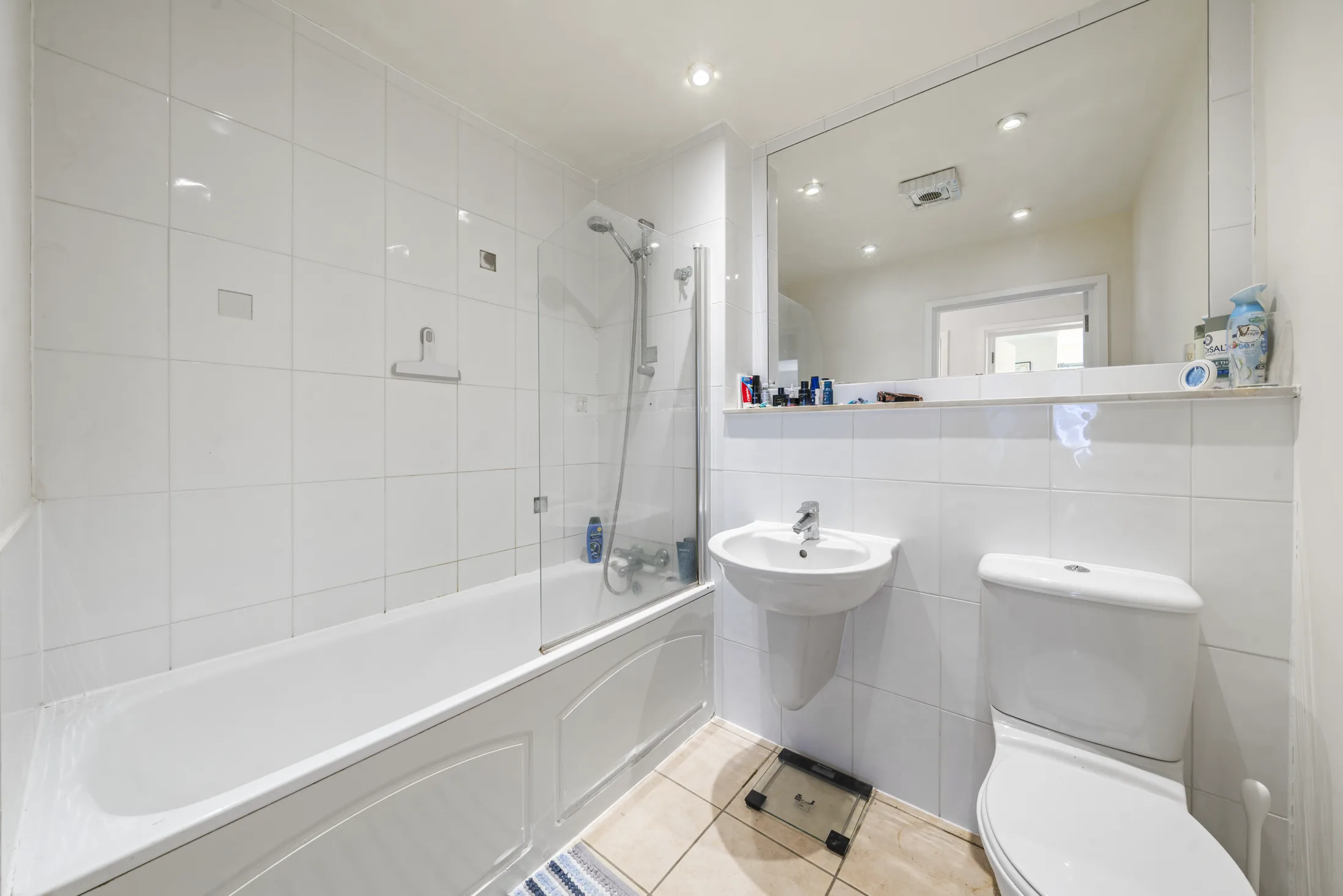 Bathroom with a bath, shower and white sanitaryware