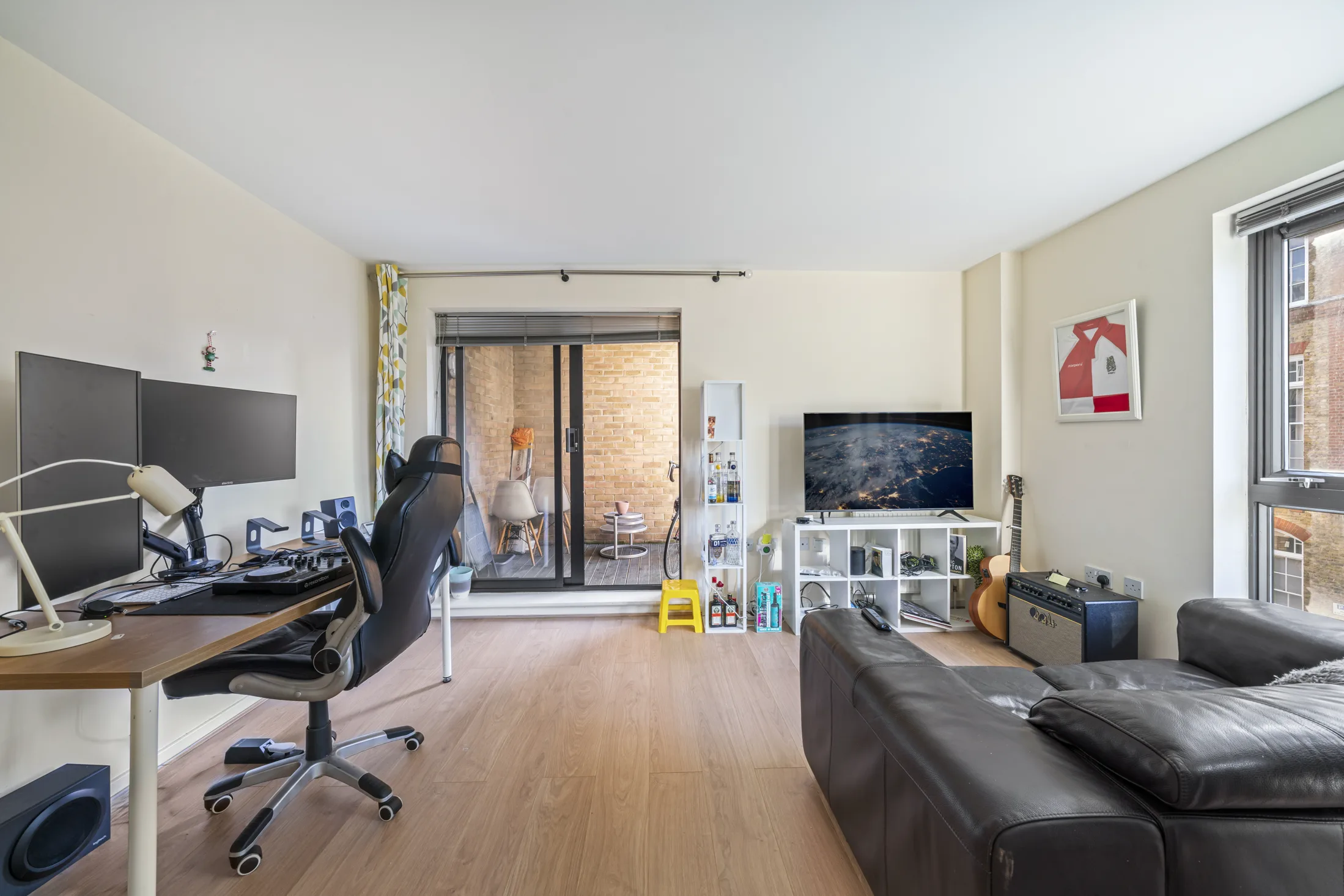 Reception room with timber flooring, seating and natural light
