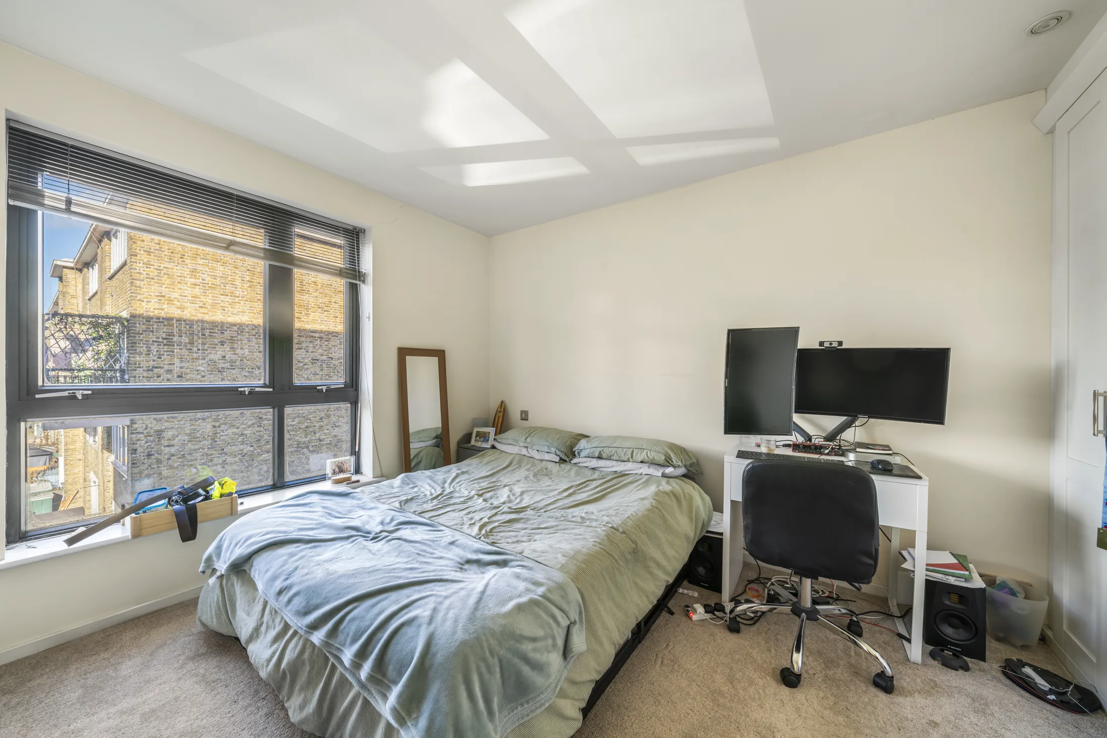 Second bedroom with a double bed and window