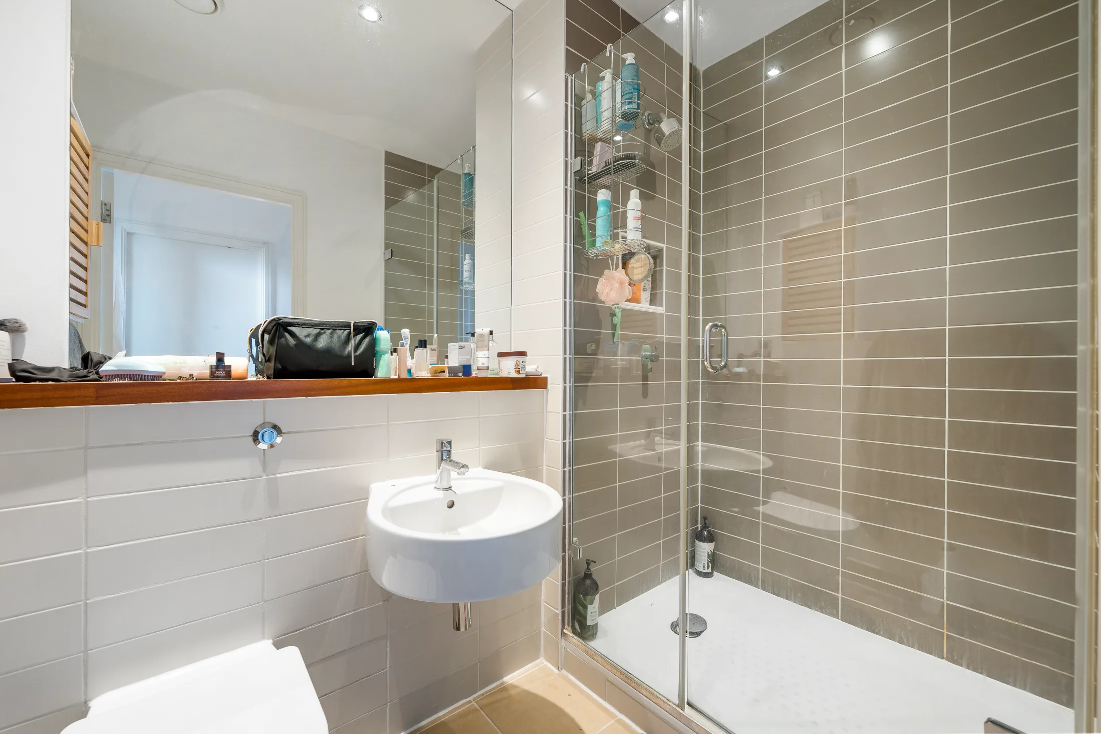 Shower room with a glass enclosure and tiled walls