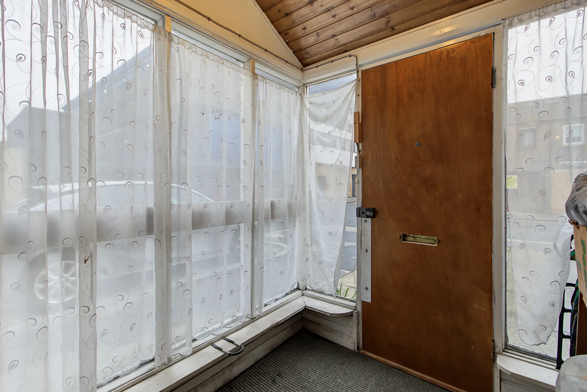 Glazed entrance porch at the front door