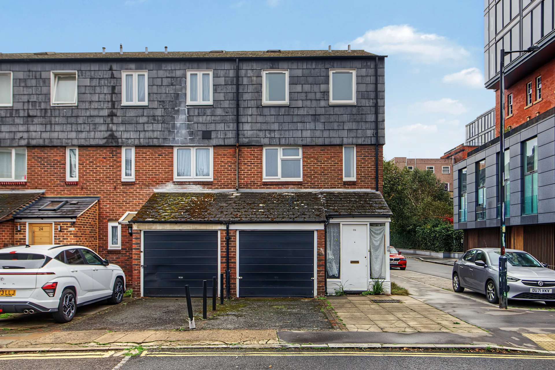 Front of the house with its garage and off-street parking
